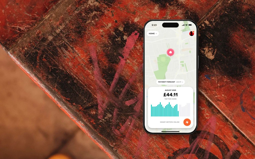 Corelynk mobile app with smart meter dashboard on a rustic red background